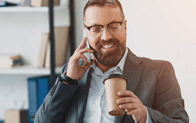 man in meeting drinking coffee